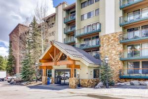 an apartment building with a gambrel roof at Impeccable Ski In Ski Out Unit with Mountain Views from Private Balcony, Steps From Downtown TE402 in Breckenridge