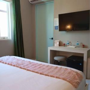 Postel nebo postele na pokoji v ubytování Trópica Beach Hotel