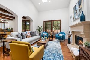 a living room with a couch and a fireplace at Gorgeous Santa Cruz Villa - Modern Beachside Paradise with NEW Hot Tub & Fast Wi-Fi in Santa Cruz
