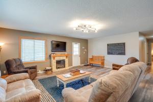 a living room with couches and a fireplace at Roosevelt Suite Less Than 1 Mi to Teddy Roosevelt Park! in Medora