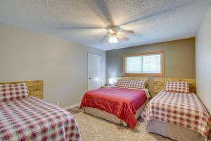 a bedroom with two beds and a ceiling fan at Roosevelt Suite Less Than 1 Mi to Teddy Roosevelt Park! in Medora
