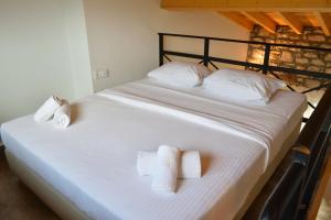 Dioscuri Deluxe Apartments客房内的一张或多张床位