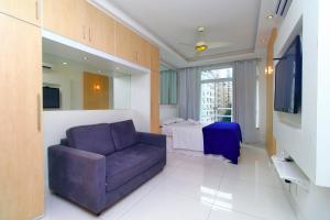 Телевизор и/или развлекательный центр в Rio Spot Homes Flat C033A