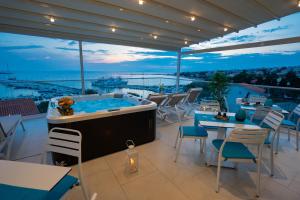 a hot tub on the roof of a building at Bed&Breakfast Novalis in Novalja