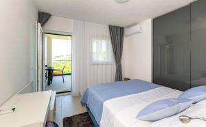 a hotel room with a bed and a balcony at Apartment Sweet Dream Manjiga in Nečujam +8 photos