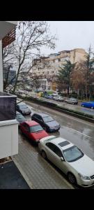 a group of cars parked in a parking lot at Apartmani 2 SS in Ohrid