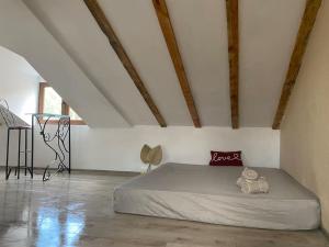 a bedroom with a large bed in a attic at Bohemian House Kapana Central in Plovdiv