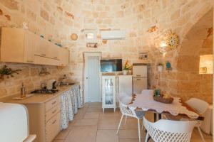 A kitchen or kitchenette at Trullo Milù with Pool