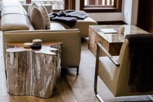 a living room with a couch and a table with cookies on it at Tremblant Prestige - Étoile 1500-5 in Mont-Tremblant +28 photos