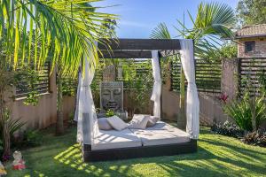 Градина пред Shiva Boutique Hotel - Praia do Rosa