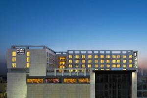 a building with a sign on top of it at Four Points by Sheraton Jaipur, City Square in Jaipur