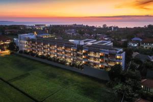 an aerial view of a building at dusk at Four Points by Sheraton Bali, Seminyak in Seminyak