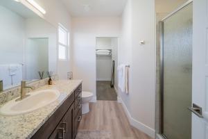 a bathroom with a sink and a toilet and a shower at Painted Desert-4Bed, 3Bath, Hot Tub, Deck in Hildale