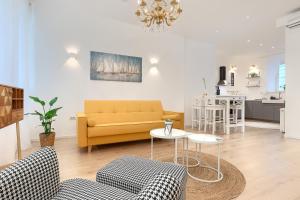 a living room with a couch and a table at Calafati Apartment with free private parking in Rijeka