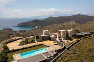 an aerial view of a house with a swimming pool at Bella Resorts Andros in Andros