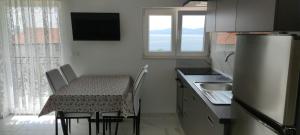 Kuhinja oz. manjša kuhinja v nastanitvi Apartments INBOX