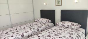 Postelja oz. postelje v sobi nastanitve Apartments INBOX