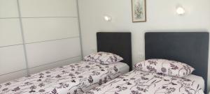 Postelja oz. postelje v sobi nastanitve Apartments INBOX