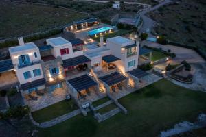 an aerial view of a house with a pool at Bella Resorts Andros in Andros