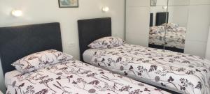 Postelja oz. postelje v sobi nastanitve Apartments INBOX