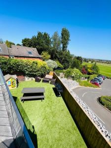 a view of the garden from the balcony of a house at Fox House in Rotherham