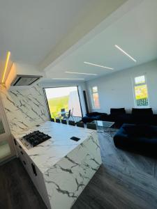 a living room with a large marble counter top at Fox House in Rotherham