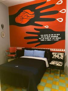 Postel nebo postele na pokoji v ubytování Chuchumbé Hotel & Hostal