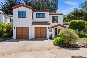 a villa with a driveway and a garage at Gorgeous Santa Cruz Villa - Modern Beachside Paradise with NEW Hot Tub & Fast Wi-Fi in Santa Cruz