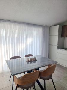 a dining room with a glass table and chairs at Adria Mare in Crikvenica +54 photos