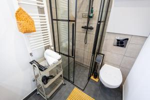 Koupelna v ubytování Sun x Mountains - Black Church + 18 fotografií