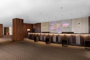a lobby with a bar in a building at Sheraton Miyako Hotel Tokyo in Tokyo