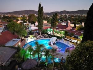 an overhead view of a swimming pool in a resort at Complejo Los Cipreses in Villa Carlos Paz
