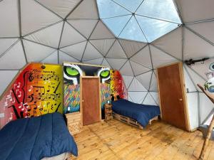 Postel nebo postele na pokoji v ubytování MANDALA CAMP