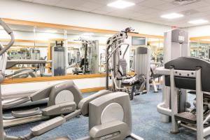 a gym with lots of treadmills and machines at Silver Beach Hotel in Saint Joseph
