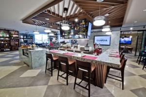 a kitchen with a large island in a store at Sheraton Laval Hotel in Laval
