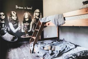 a bedroom with a bunk bed with a poster of a band at Sarnówka KDN in Rajcza