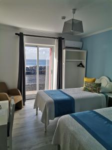 Postel nebo postele na pokoji v ubytování Ocean Breeze