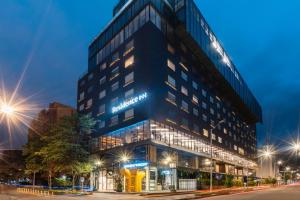 a tall black building with lights on at Residence Inn by Marriott Bogota in Bogotá