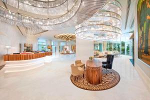 a lobby of a hotel with a large chandelier at ITC Kohenur, a Luxury Collection Hotel, Hyderabad in Hyderabad