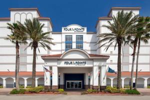 uma representação da frente do hotel Trump Palm Island em Four Points by Sheraton Jacksonville Beachfront em Jacksonville Beach