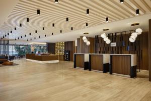 a lobby with a bar in the middle of a building at Sheraton Djibouti in Djibouti