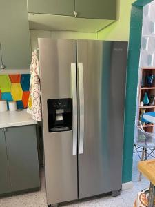 a stainless steel refrigerator with a dispenser on it at The Flamingo Palms private 1bd 1ba Unit in Duplex in Palm Springs