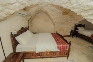 Postel nebo postele na pokoji v ubytování Kasr-ı Hayat