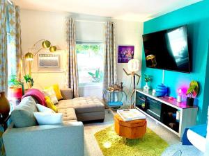 A television and/or entertainment centre at The Flamingo Palms private 1bd 1ba Unit in Duplex