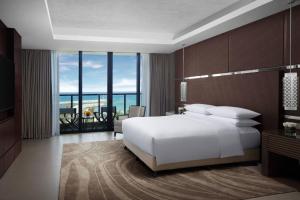 Ένα ή περισσότερα κρεβάτια σε δωμάτιο στο Marriott Resort Xiangshui Bay