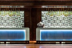 a display case with white vases on display in a store at Renaissance Tuscany Il Ciocco Resort & Spa in Barga