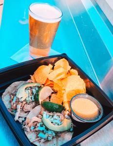 a tray of food with chips and a drink at San Diego Marriott Gaslamp Quarter in San Diego