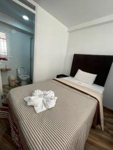 Cama o camas de una habitación en HOTEL KILLASUMAQ