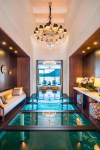 a large living room with a large glass floor at The St. Regis Langkawi in Kuah