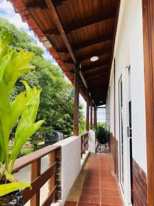 a porch of a house with a wooden roof at La Casona Llanera in San Martín